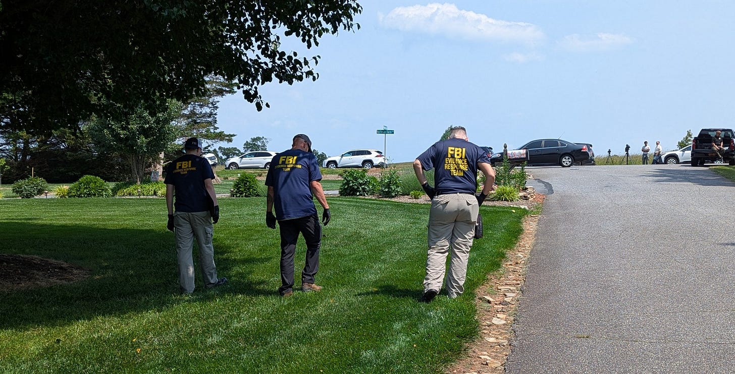People walking in FBI shirts
