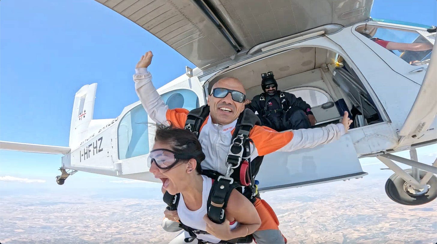 Filipo, my tandem partner is strapped to my back. He let's go of the plane and we free fall. Filipo, my tandem partner is strapped to my back. He let's go of the plane and we free fall.