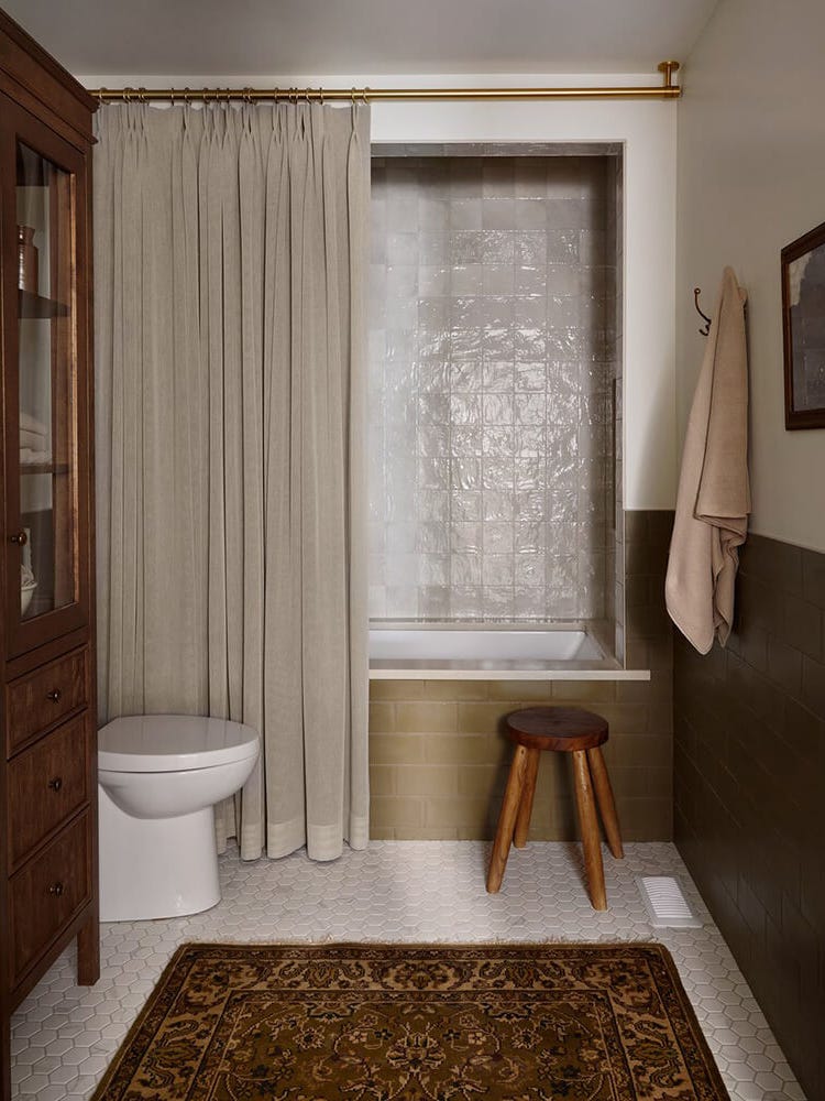 Moody bathroom with antique rug Moody bathroom with antique rug