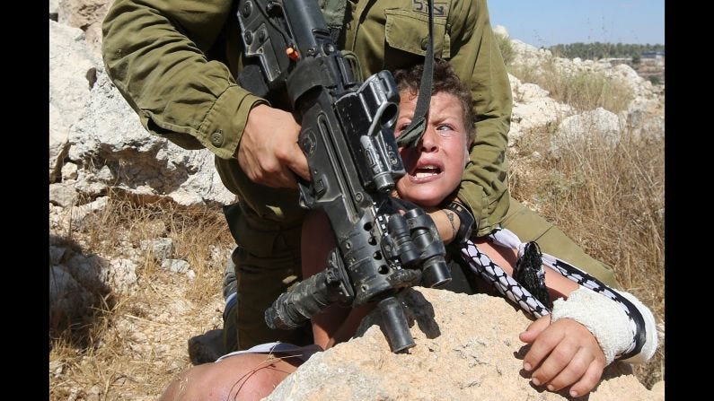 Israeli soldier tries to arrest Palestinian boy | CNN