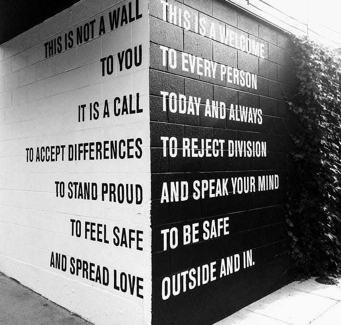 A work of art; one white wall, and one black. It shares a message of diversity and pride in difference. A work of art; one white wall, and one black. It shares a message of diversity and pride in difference.