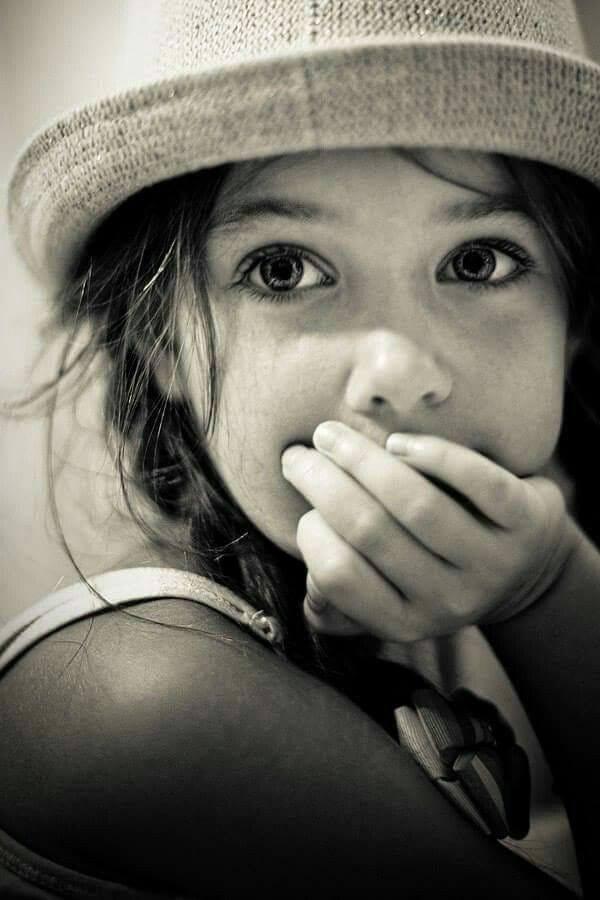 May be a black-and-white image of baby and hat