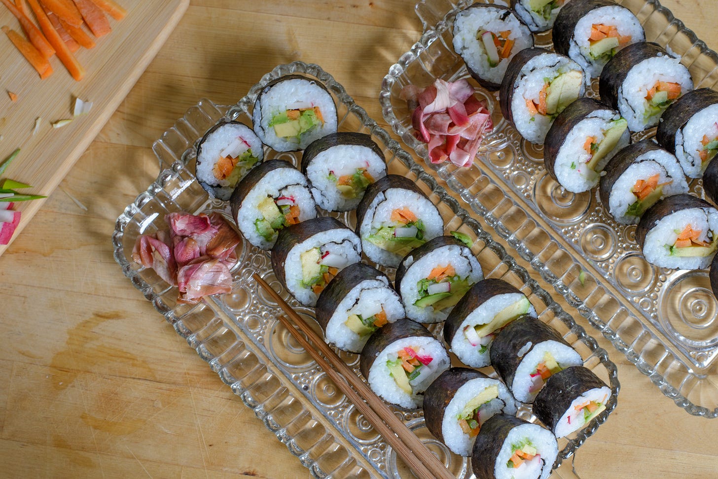 Magnolia pickles in a pile next to rows of veggie sushi.