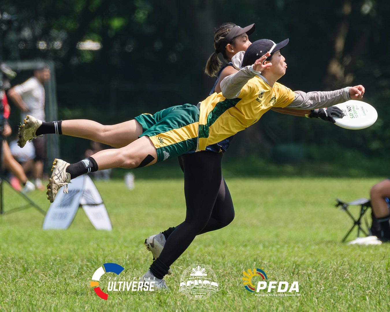 May be an image of 2 people, people playing football, people playing American football, frisbee and text