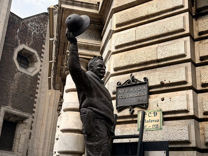 Avenida Francisco I. Madero, statue of the namesake, throngs of pedestrians, blue tiles