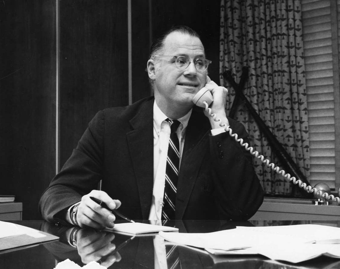 Bowie Kuhn answers a telephone.
