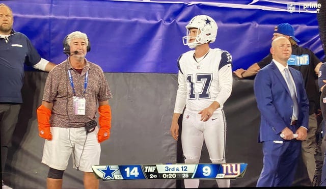r/nfl - Anybody know what the man with the orange gloves is responsible for? The gloves have the NFL logo on them. 