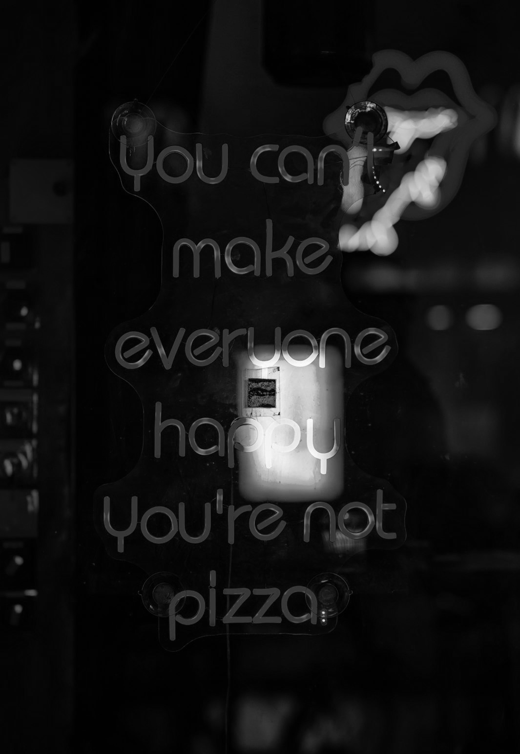 A neon sign that says you can't make everyone happy you're not