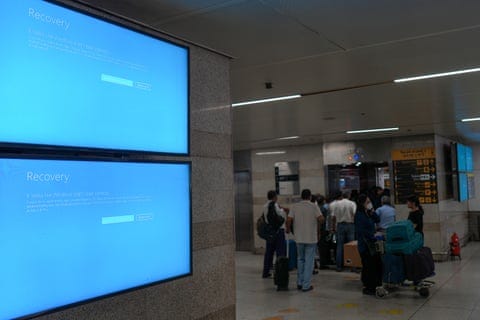 Digital boards in New Delhi, India, display error messages due to the global IT outage caused by CrowdStrike on 19 July 2024.