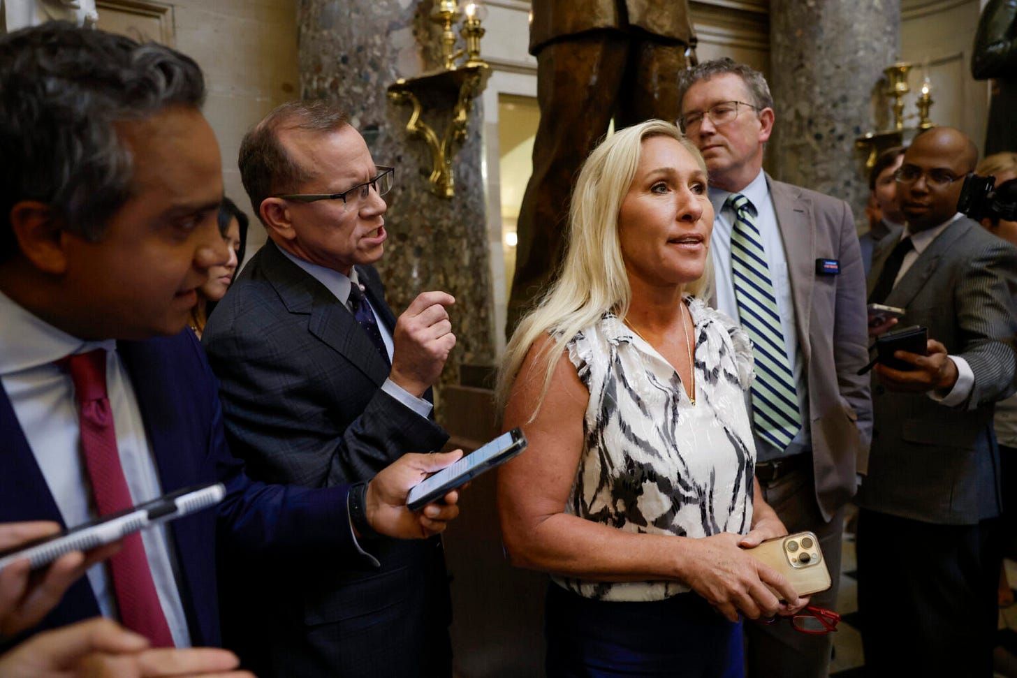 Rep. Marjorie Taylor Greene huddles with U.S. House speaker she's trying to  oust • Nebraska Examiner