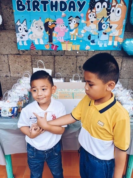 Rafa and Miguel having fun at Rafa's Bluey-themed birthday party