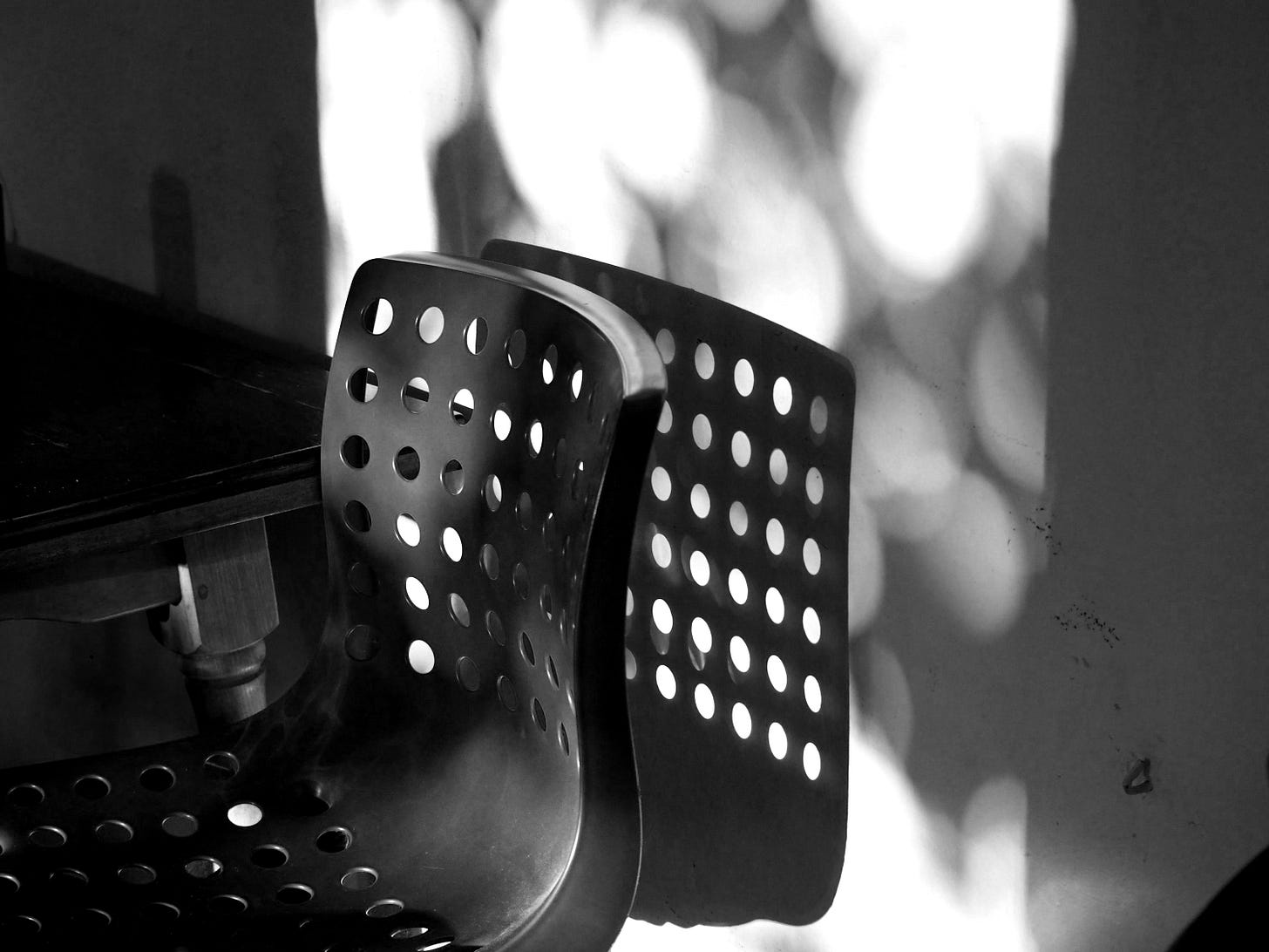 a couple of red chairs sitting next to a table a couple of red chairs sitting next to a table