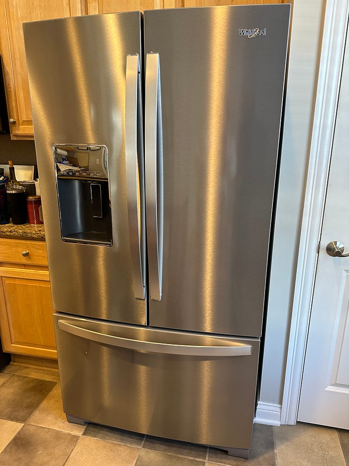 Refrigerator on the left, washer/dryer on the right