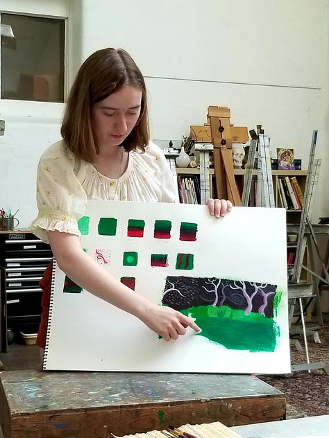 Happy painters holding up their Mary Blair-inspired paintings.