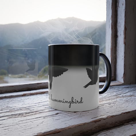 A gallery of three images shows the new Nature Moments Gear color-changing mug, featuring the Hummingbird Silhouettes design.