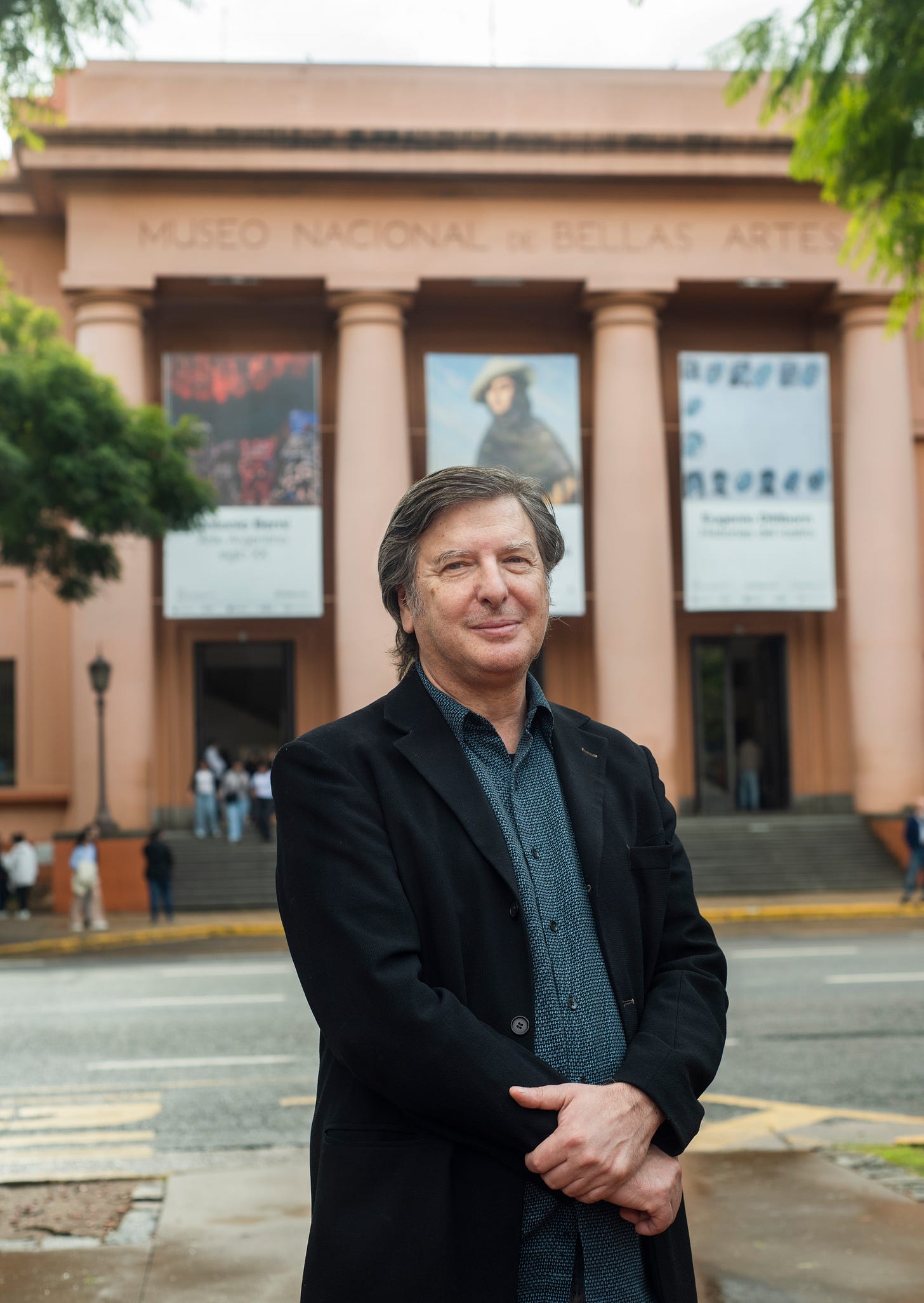 Portrait of Andrés Duprat standing in front of the National Museum of Fine Arts in Buenos Aires, with the museum façade and exhibition banners visible in the background. Portrait of Andrés Duprat standing in front of the National Museum of Fine Arts in Buenos Aires, with the museum façade and exhibition banners visible in the background.