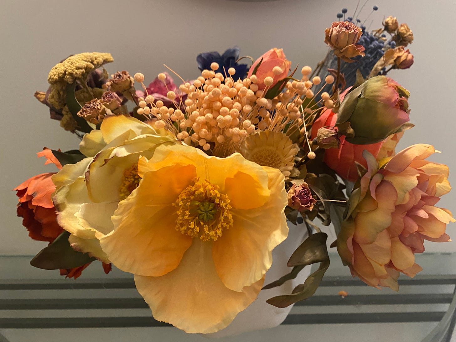 pastel rainbow fake flowers in a bowl