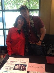 Chad helps sell Fangasm in the vendors room at Burcon