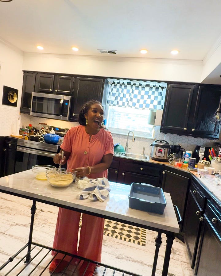 Behind-the-scenes of The Soul Food Pot® cookbook photoshoot showing Shaunda Necole mixing ingredients in a home kitchen while being filmed, capturing modern soul food recipe creation and storytelling