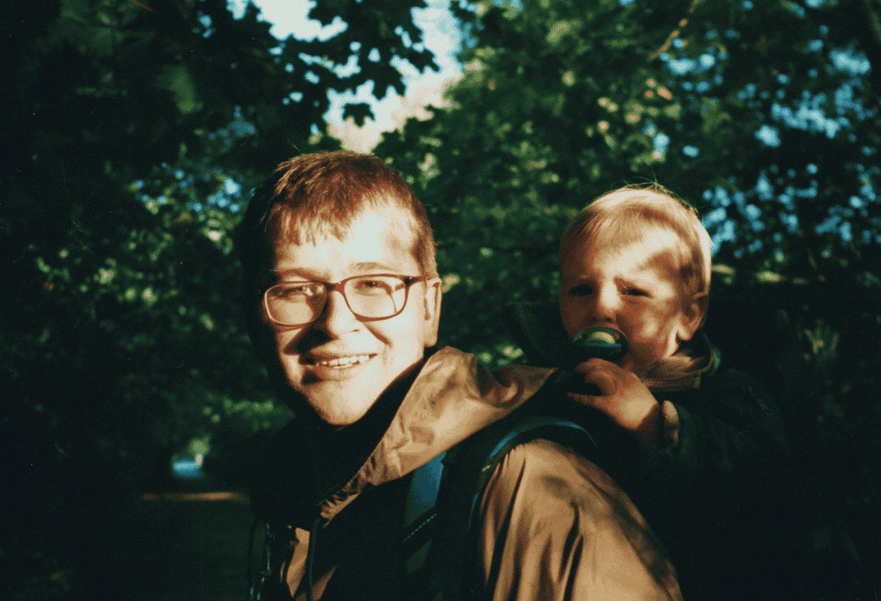 Dru Jaeger walking with his young son in the Lake District