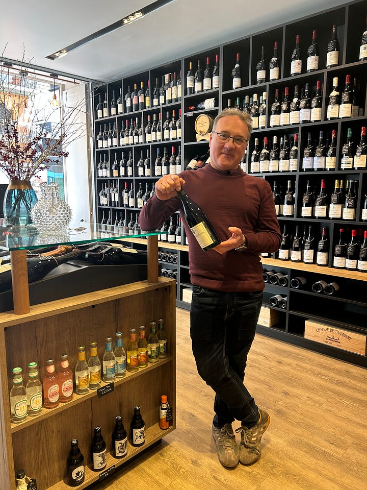 a wine shop and the owner on rue du Bac
