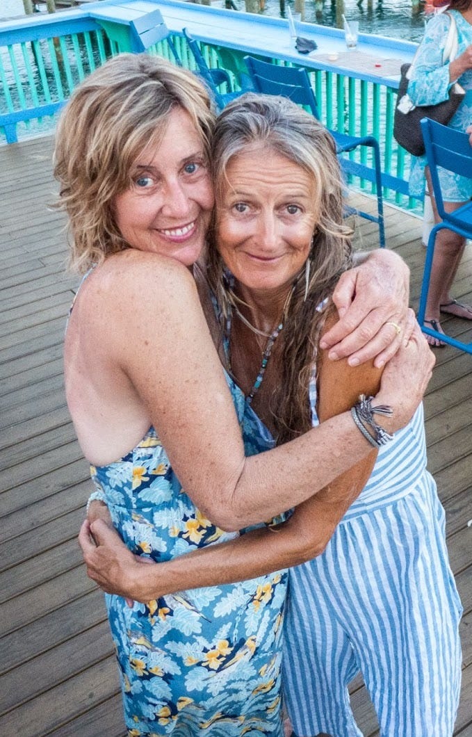 friends Allee and Amlas on the deck of restaurant