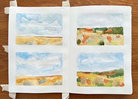 Watercolour landscapes in a sketchbook