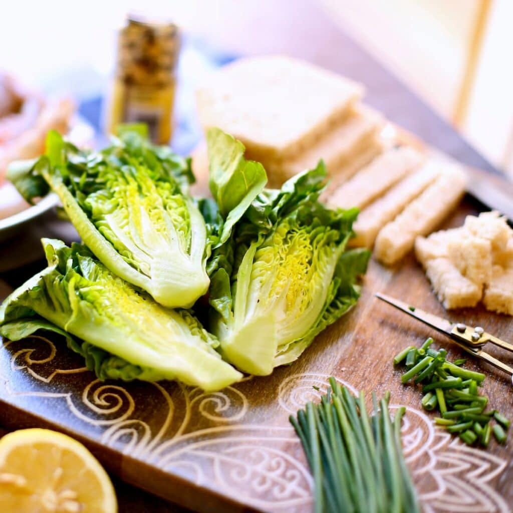 a table filled with salad ingredients. a table filled with salad ingredients.