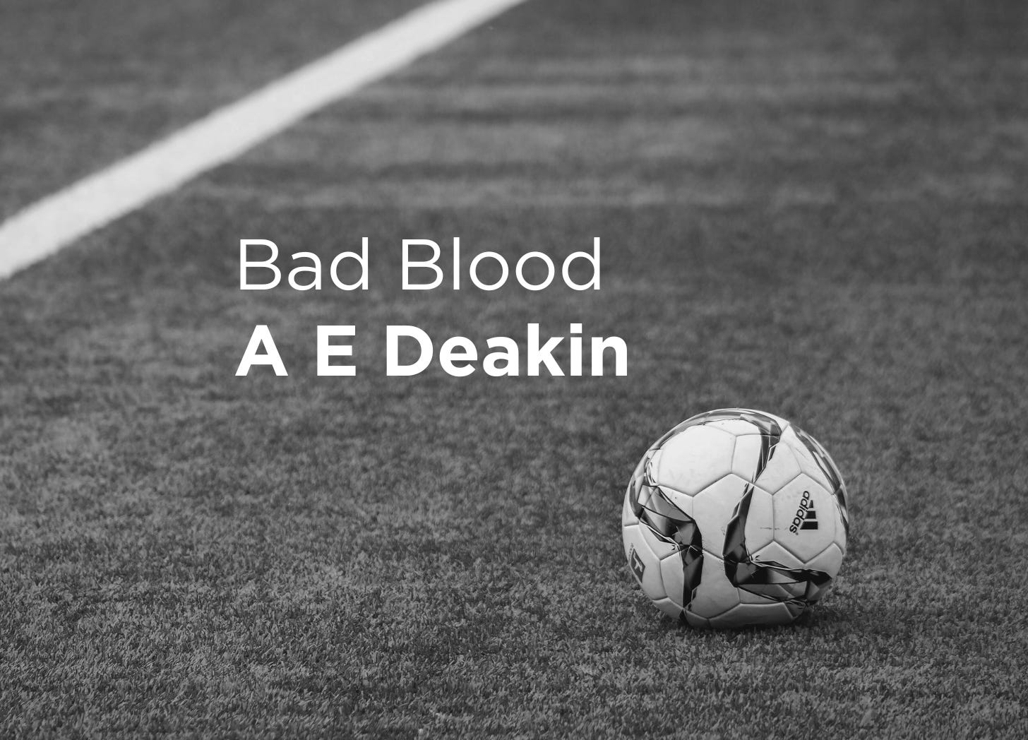 Greyscale close up of a football on a pitch. Bad Blood A E Deakin