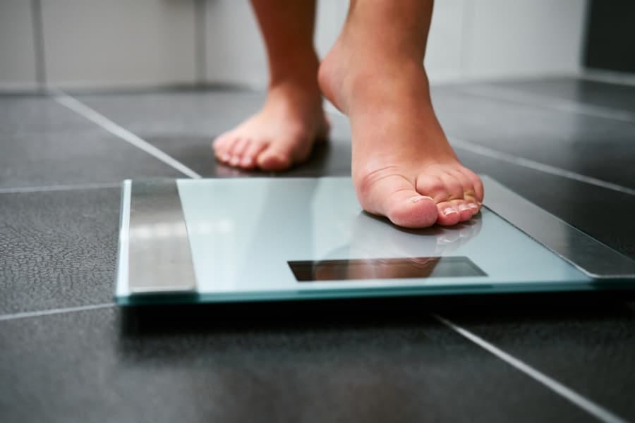 Person-stepping-on-scale - Vanguard Med Group