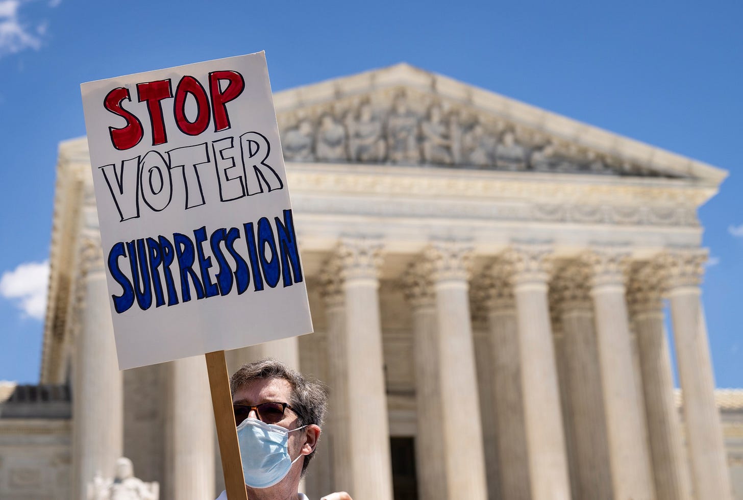 Activists rally for voting rights outside the Supreme Court on June 23, 2021.