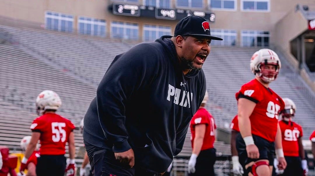 Wisconsin Badgers defensive line coach EJ Whitlow on the field during a fall camp practice.