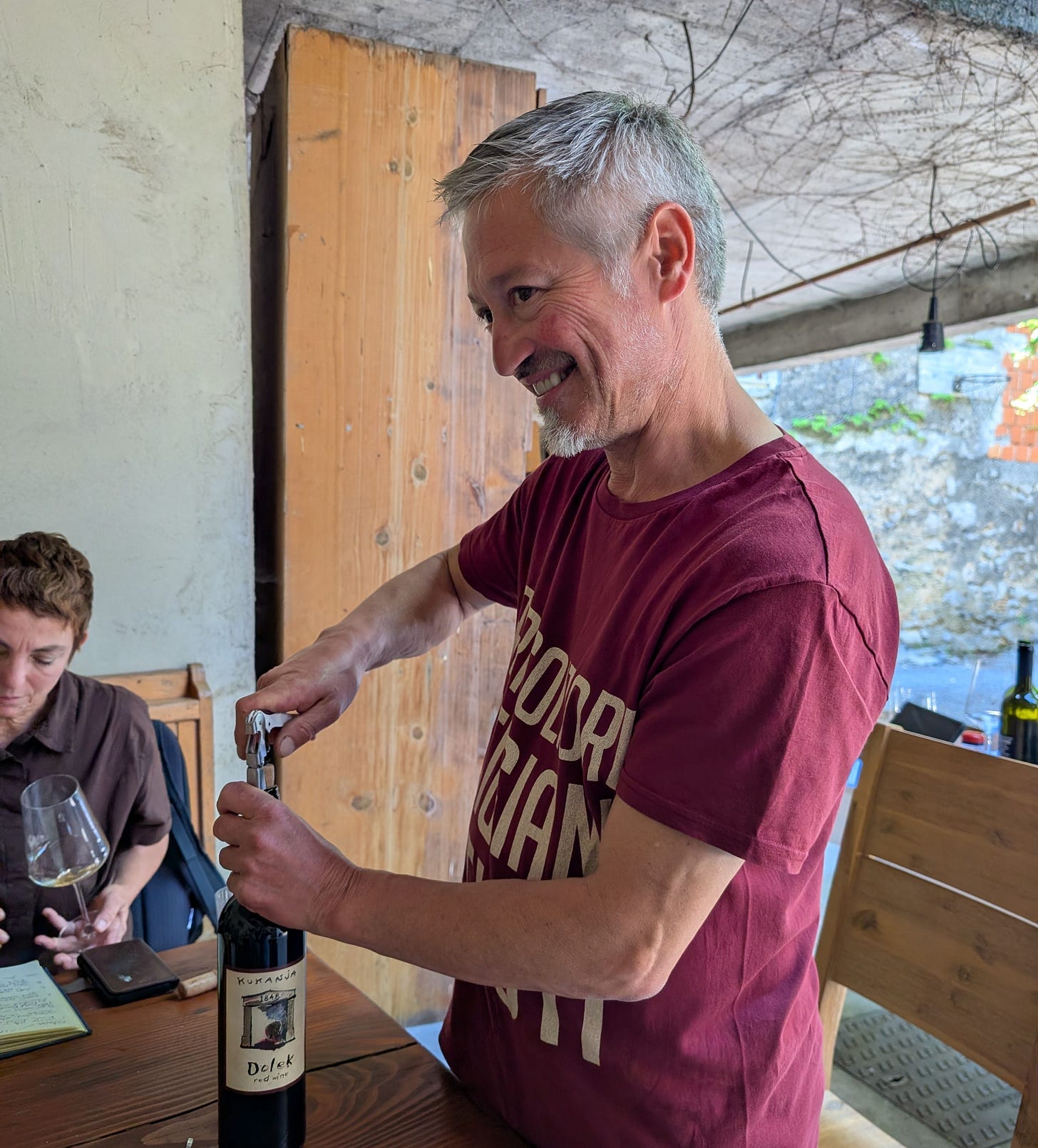Dejan Kukanja opening a bottle. Dejan Kukanja opening a bottle.