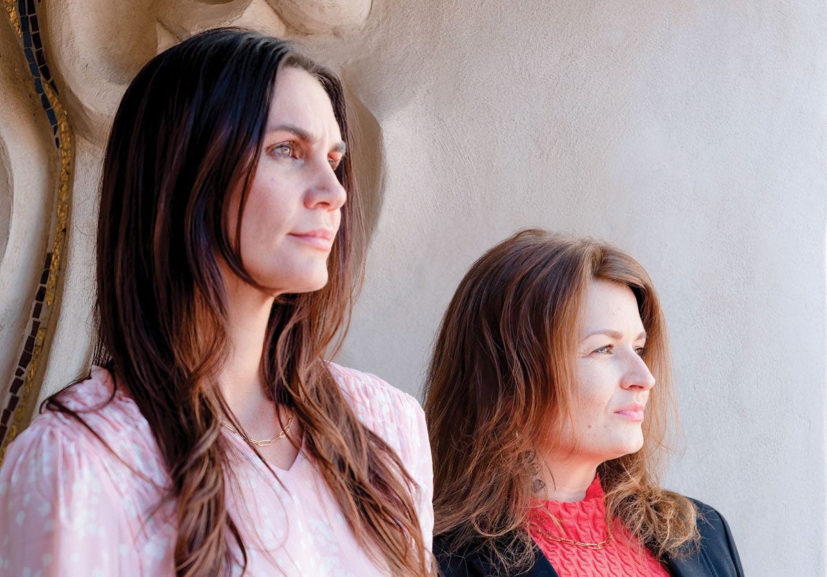 Megan Andrew, left, and Liz Campbell stand outside of the Vista Courthouse on April 30. The two were victims of domestic violence by Sean Loeffler, who was sentenced to two years in prison and was released several weeks ago. Photo by Coast News