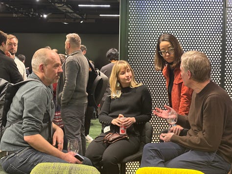 Participants networking, listening to talks, and discussing agents and data engineering during a community night at Google.