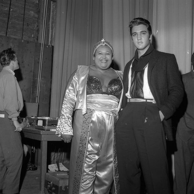 Willa Monroe poses for a photo with Elvis Presley during WDIA's Goodwill Revue on Dec. 6, 1957.