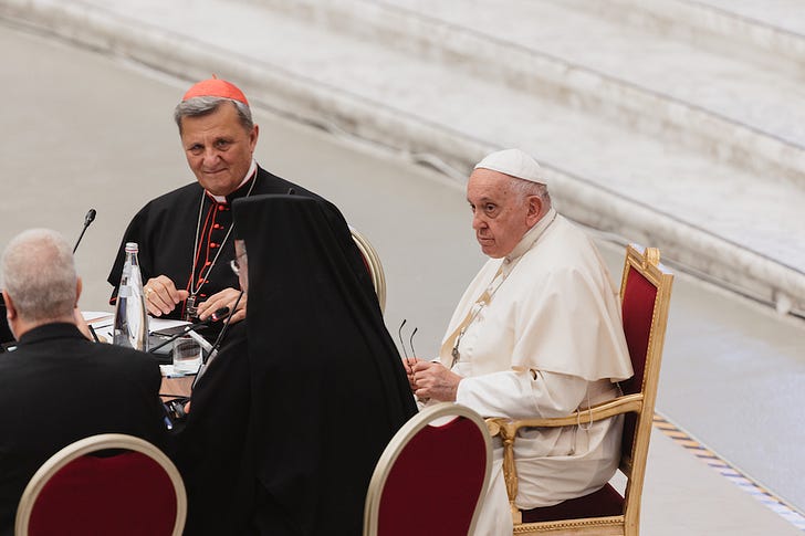 Pope Francis and Cardinal Mario Grech meet during the synod on synodality, in a photo posted to an unsecured cloud server during the assembly.