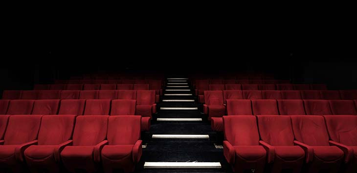 Photo of an empty theatre auditorium.