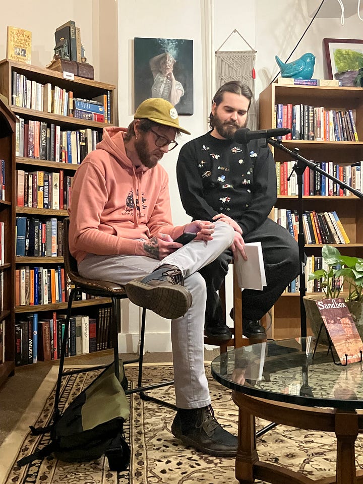 1. A table with my chapbook and Will's. 2. Will reading a poem and me listening.
