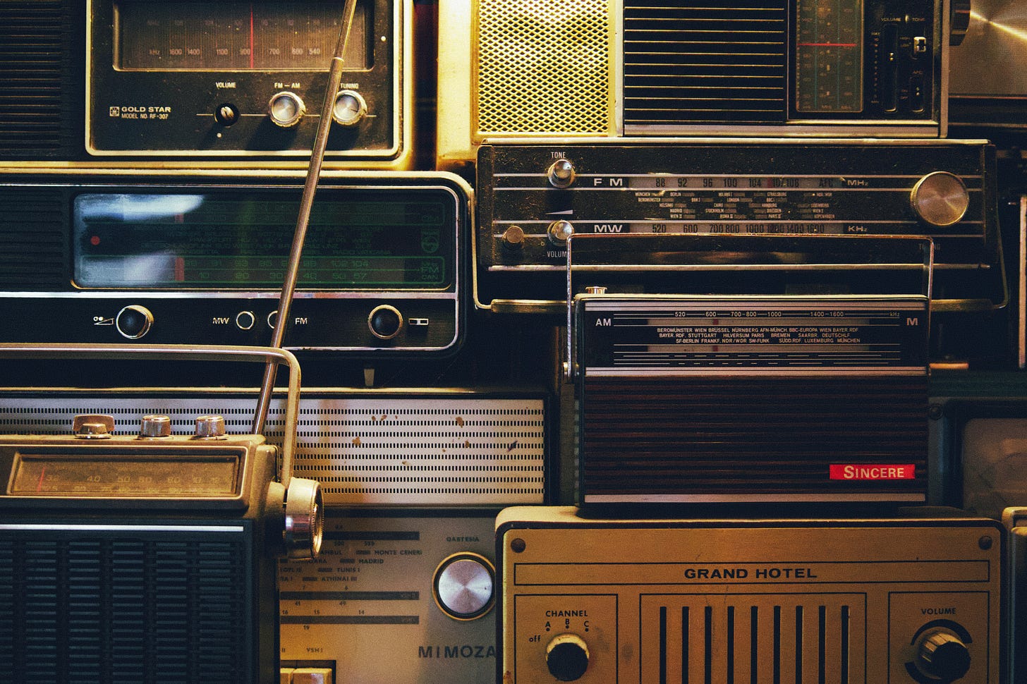 A collage of old fashioned radios.