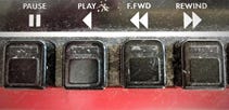The switches on an old-fashioned tape recorder.