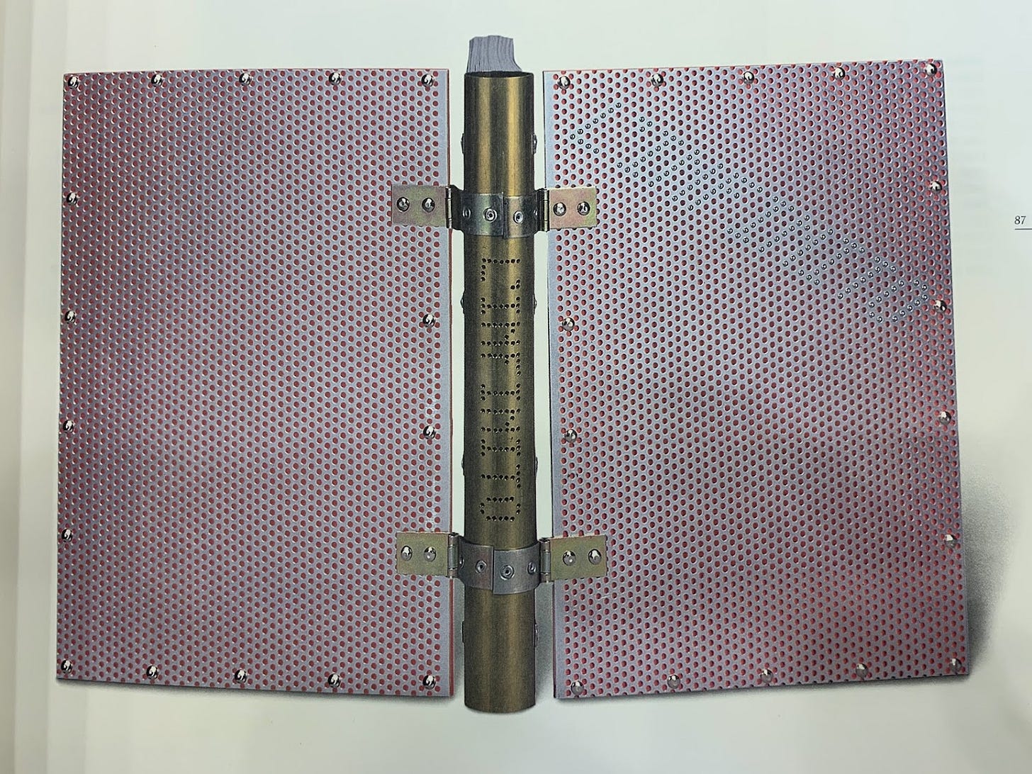 Metal-worked spine and boards.