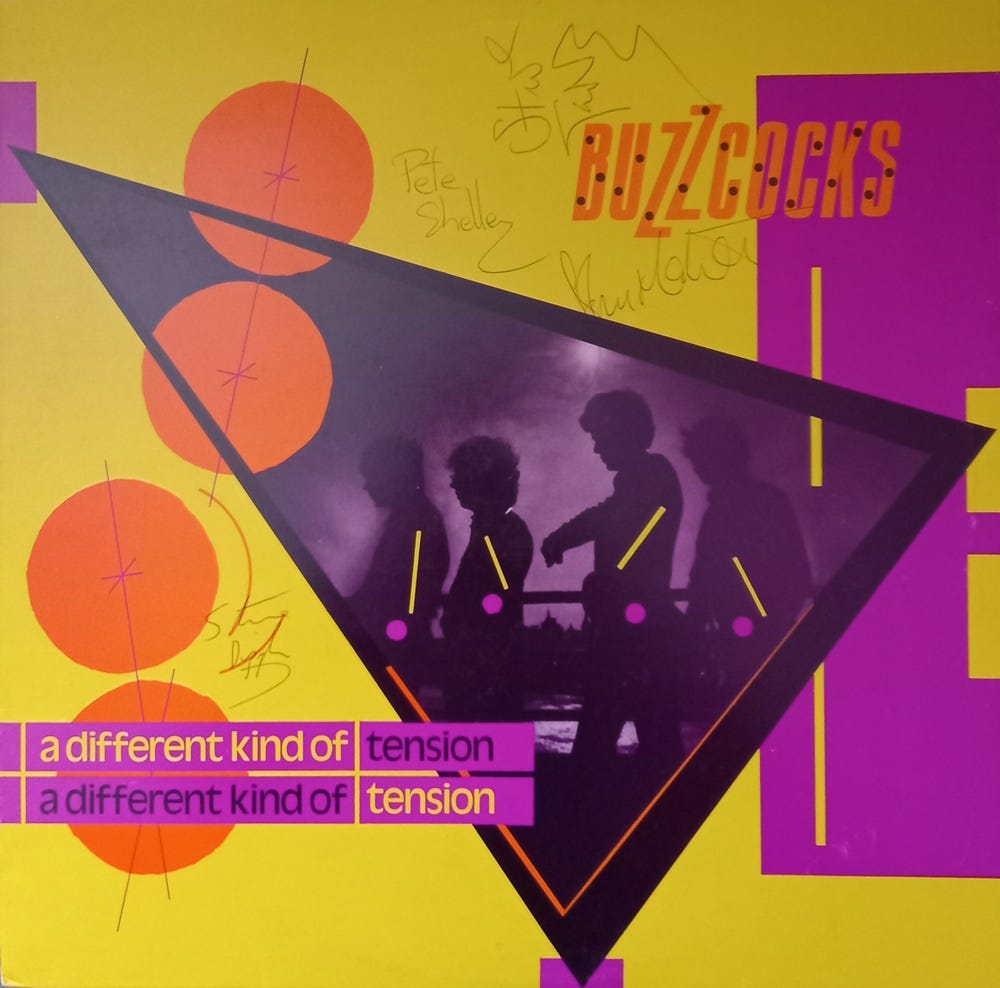 A copy of the LP A Different Kind of Tension, autographed by the band.