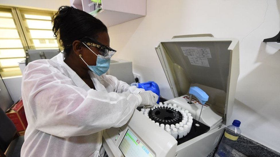 Laboratory assistant director Stella Atewe analyses chemistry profiles at the Lagos State Isolation Centre in Yaba, Lagos Laboratory assistant director Stella Atewe analyses chemistry profiles at the Lagos State Isolation Centre in Yaba, Lagos