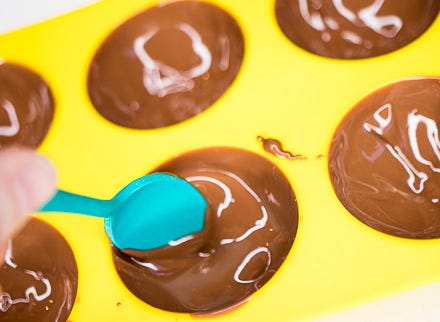 Fill hot chocolate mold Fill hot chocolate mold