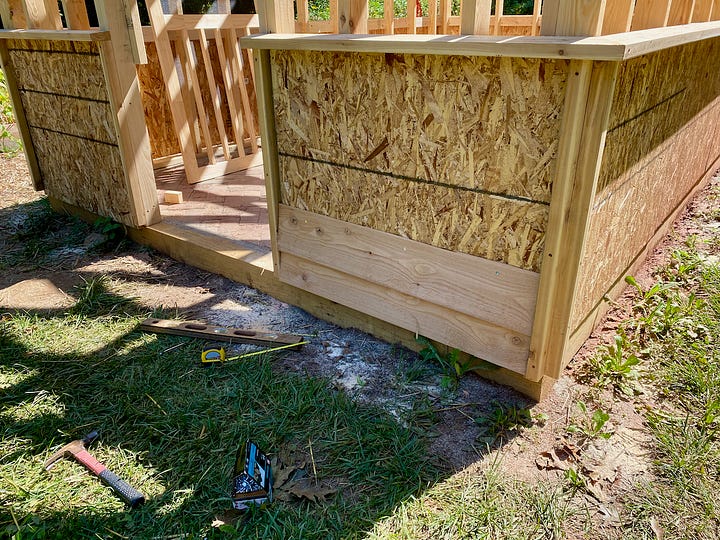 Cedar siding on a greenhouse.