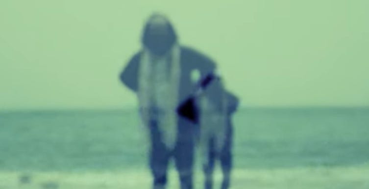 A blurry image of a person standing on a beach

AI-generated content may be incorrect.