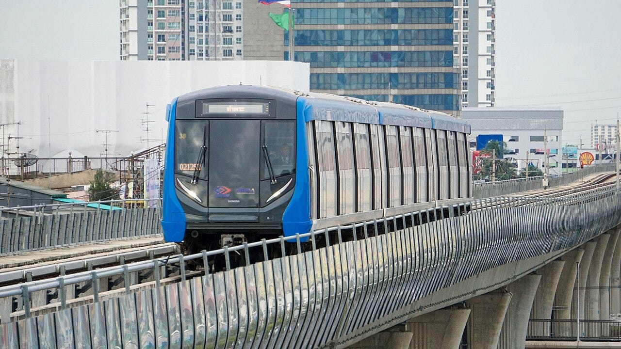 Gliding above the city: Thailand's MRT Blue Line cruising along the elevated tracks of Bangkok.