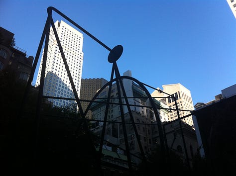 Three pictures, all of towering skyscrapers against blue skies