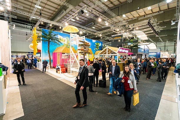 ITB Berlin 2016 Berlin, Germany - March 10, 2016: Visitors walking around the aisles during the ITB Berlin 2016 held in Messe Berlin fairgrounds in Berlin, Germany trade show stock pictures, royalty-free photos & images ITB Berlin 2016 Berlin, Germany - March 10, 2016: Visitors walking around the aisles during the ITB Berlin 2016 held in Messe Berlin fairgrounds in Berlin, Germany trade show stock pictures, royalty-free photos & images